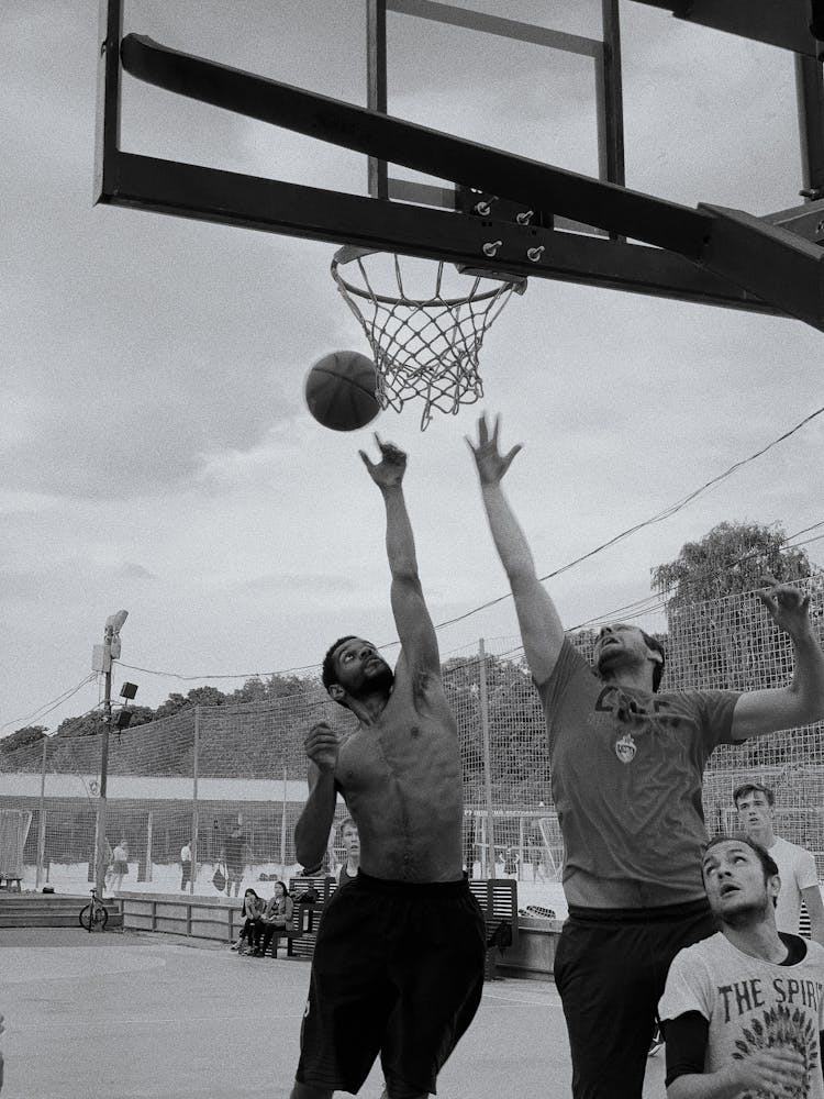 Men Playing Basketball