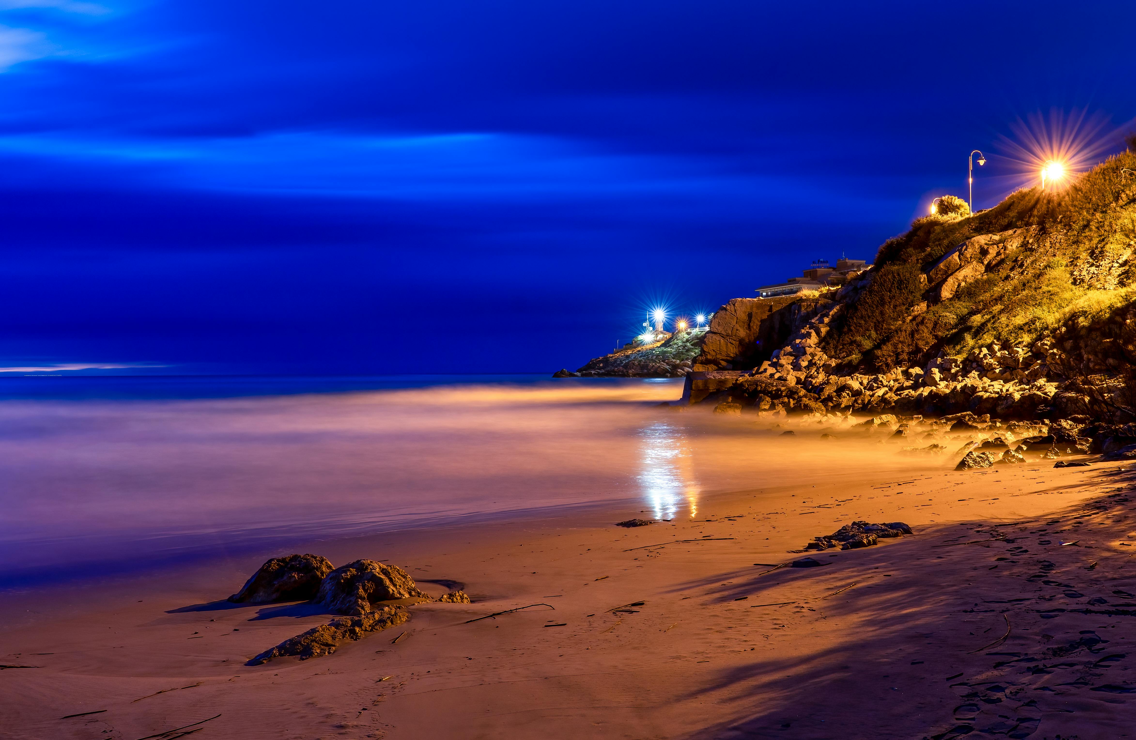 dramatic night view of cullera beach spain