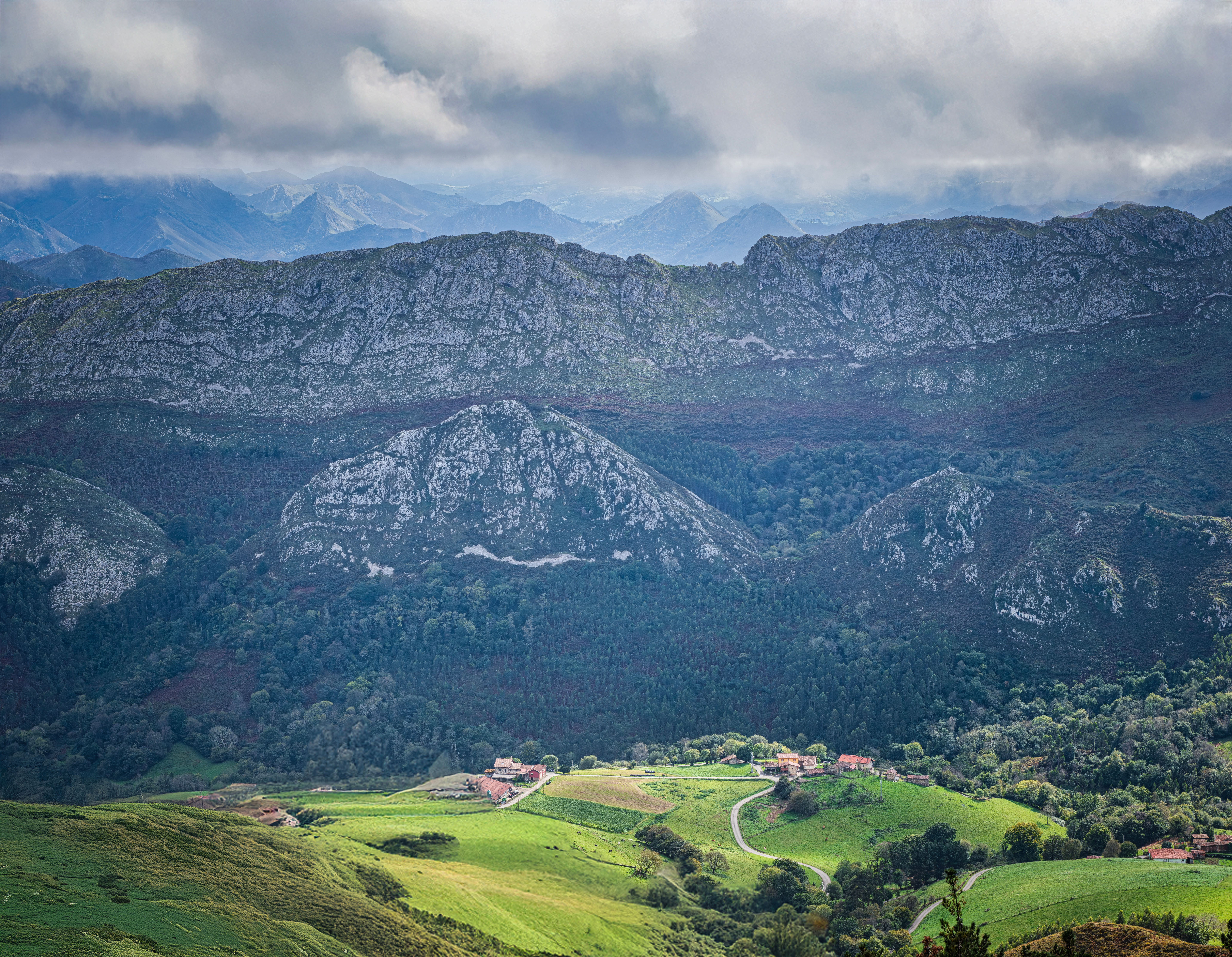 Scenic Mountain Valley with Lush Green Fields