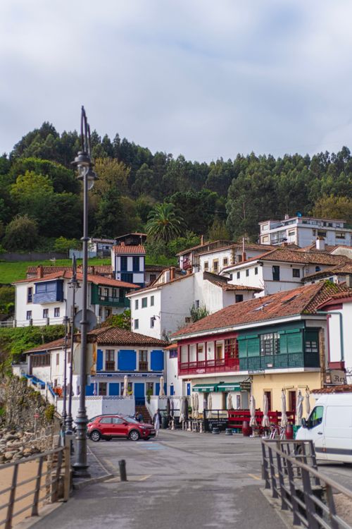 Free Colorful hillside village with rustic buildings in a coastal town, showcasing charming European architecture. Stock Photo