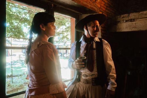 Free Argentine gaucho indoors holding mate, showcasing traditional clothing and culture. Stock Photo