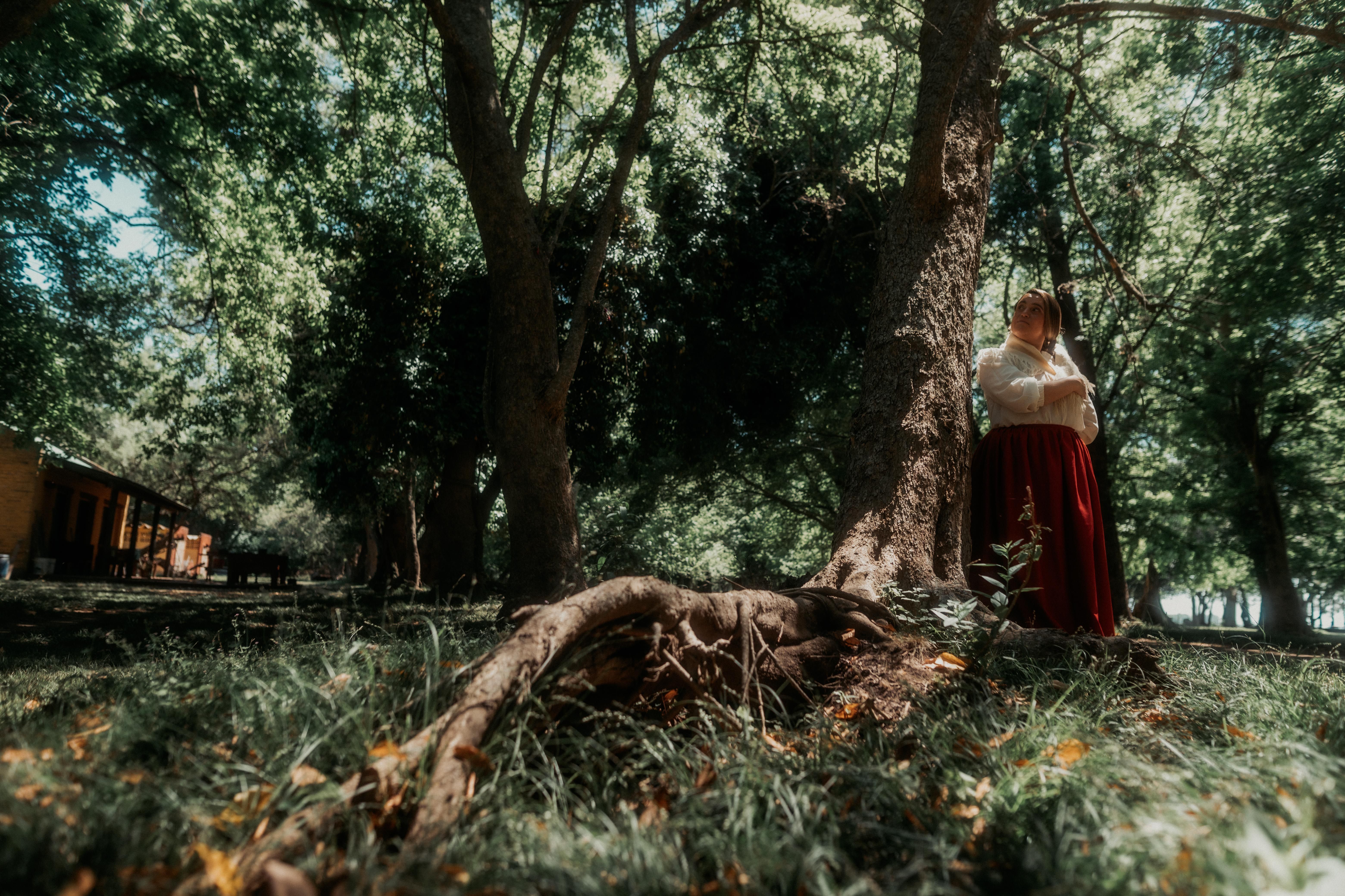 Rustic Scene with Traditional Dress in Forest · Free Stock Photo