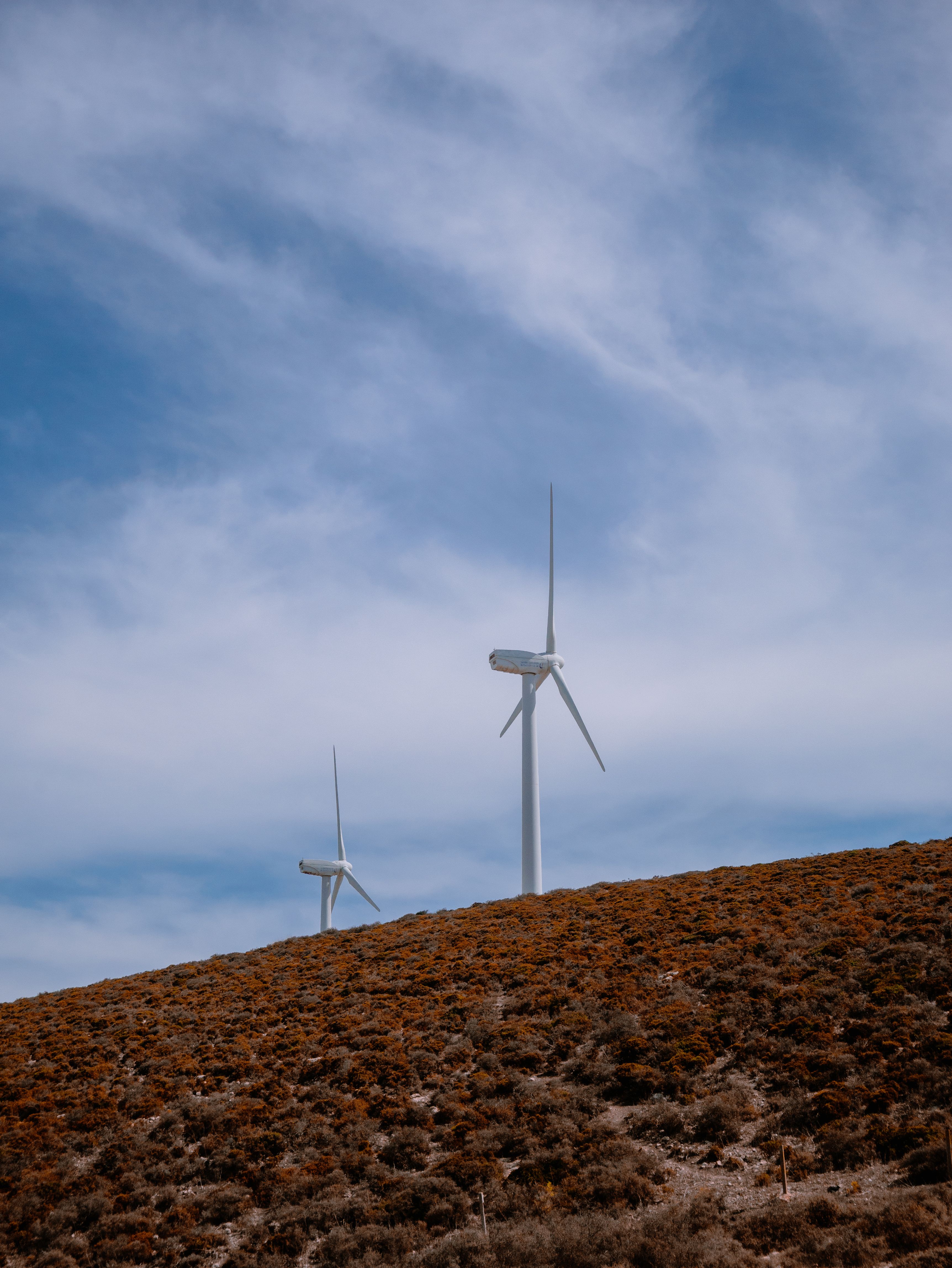 Wind Turbines on Hillside Under Blue Sky · Free Stock Photo