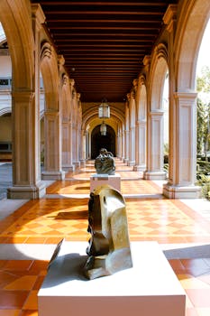 A beautiful arched corridor with sculptures under sunlight in Tequila, Jalisco, Mexico.