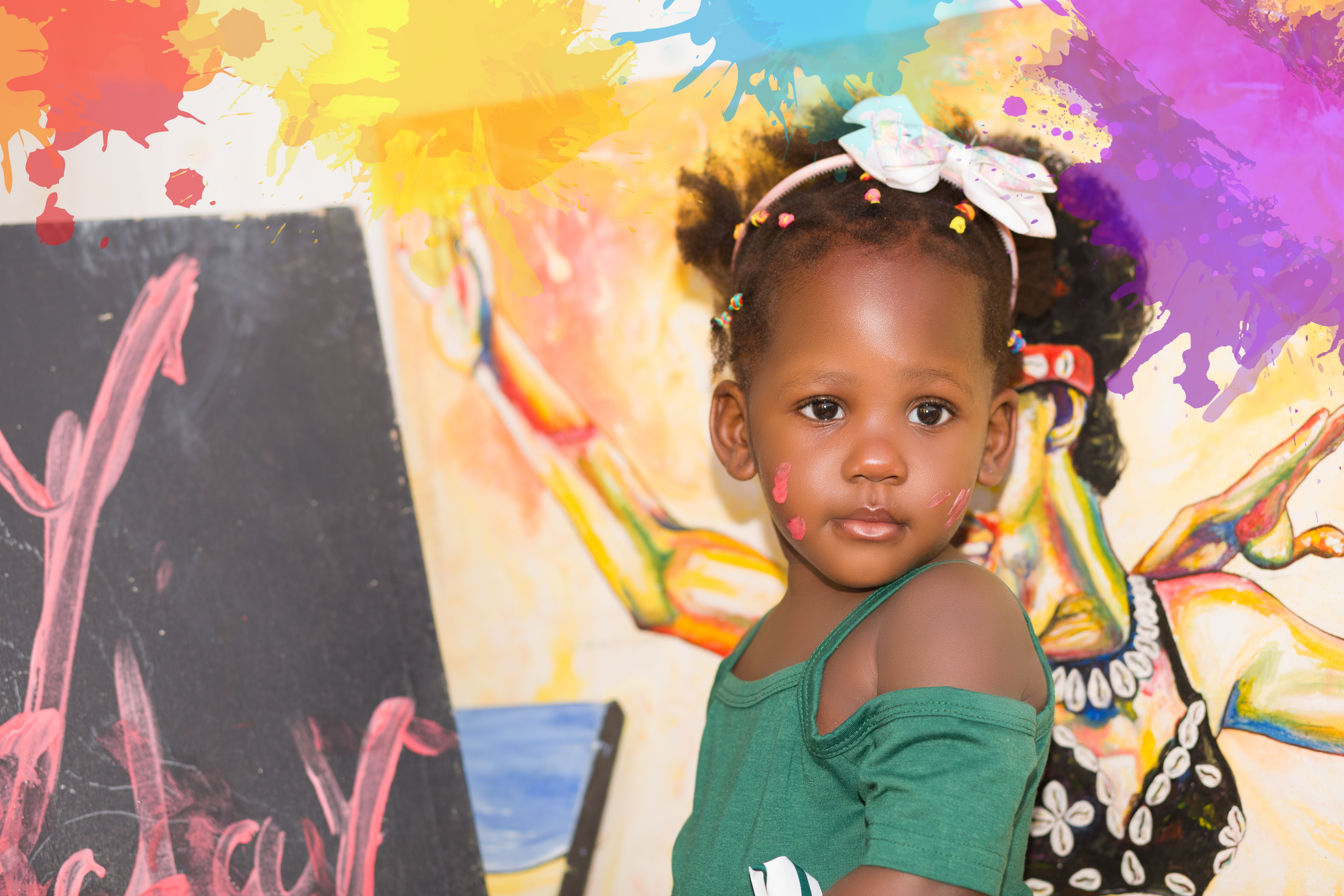 Vibrant portrait of a child with a creative, colorful backdrop.