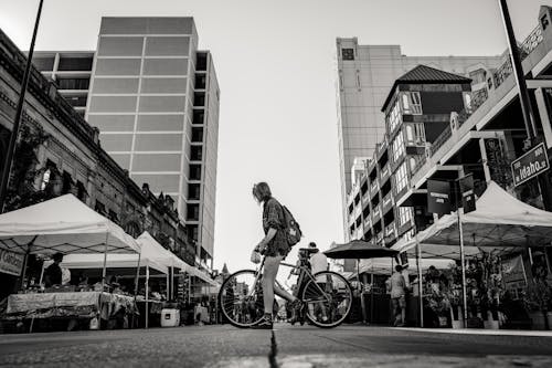 Free Monochrome Photo of Person Holding Bike Stock Photo