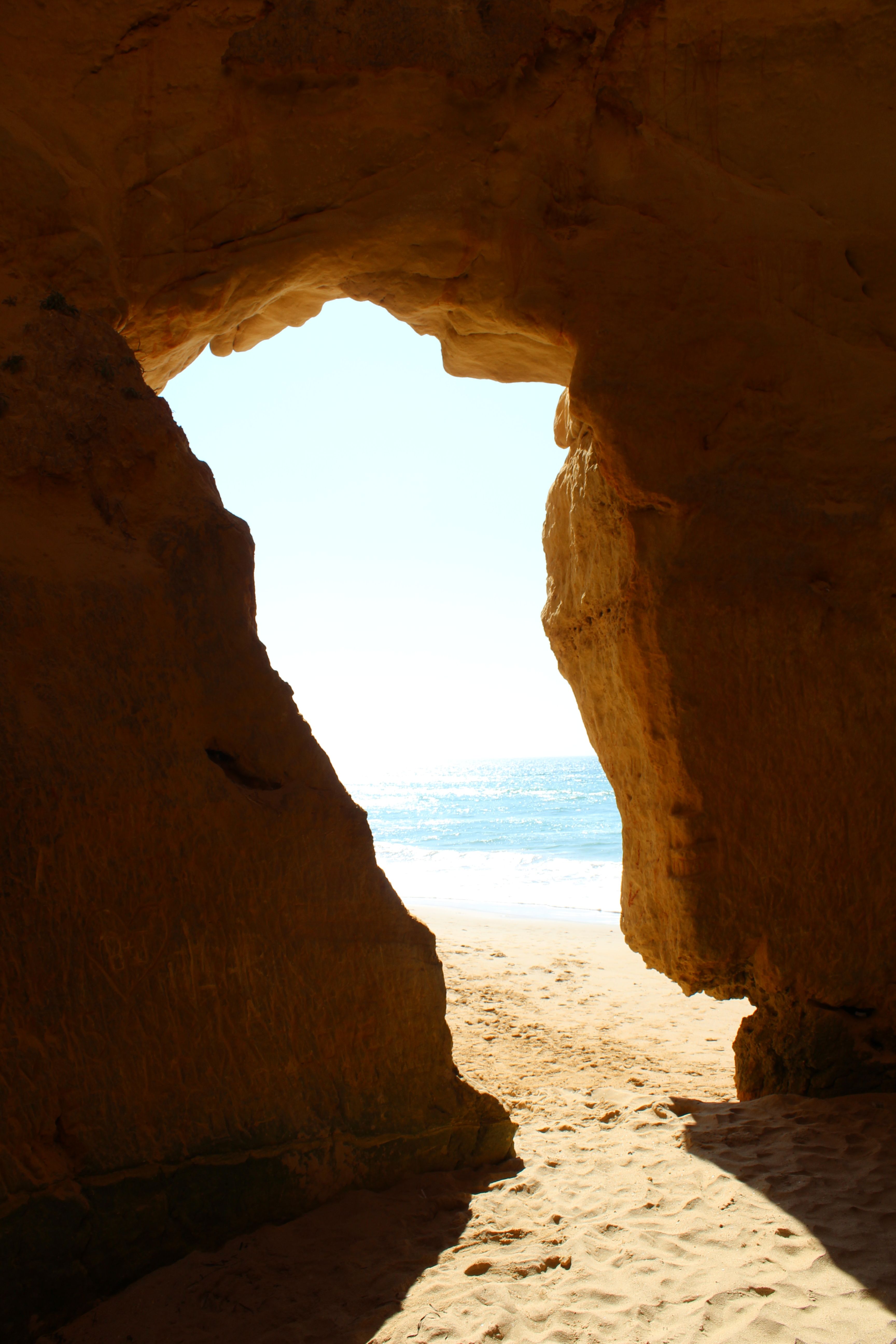 Scenic Beach View Through Natural Rock Arch · Free Stock Photo
