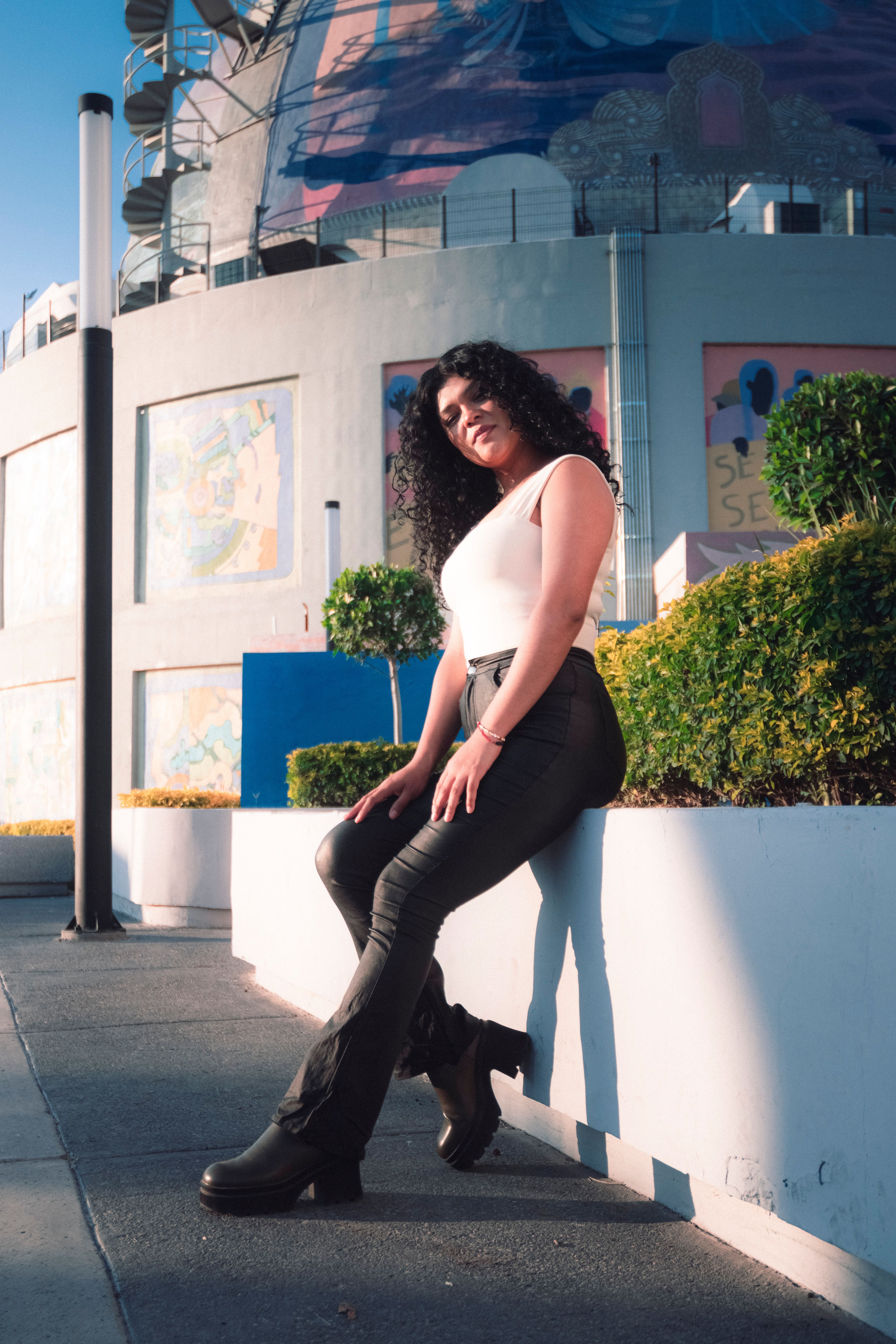 Stylish Woman Posing Outdoors in Urban Setting · Free Stock Photo