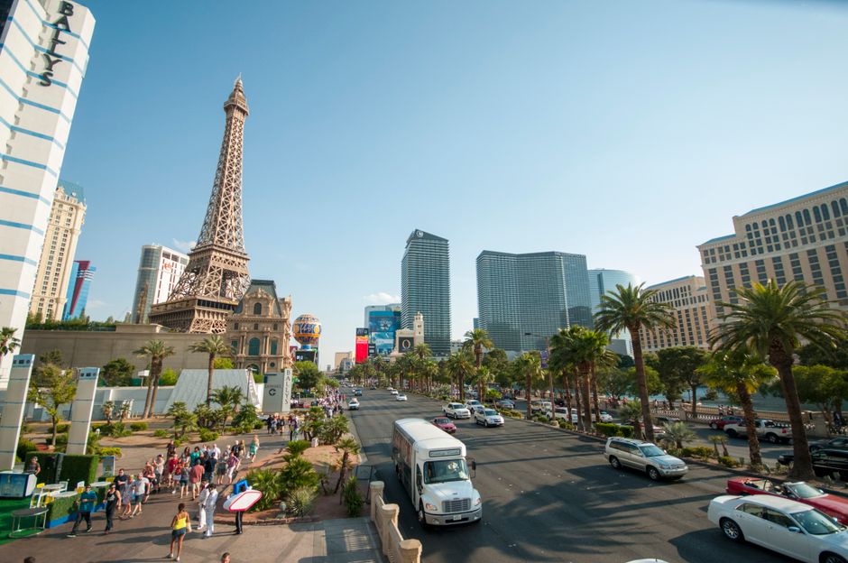 Ultimate Red Rock Canyon Helicopter Air-Only Tour in Las Vegas Review Review 2026 - Bustling Las Vegas Strip showcasing iconic Eiffel Tower replica against a clear sky.