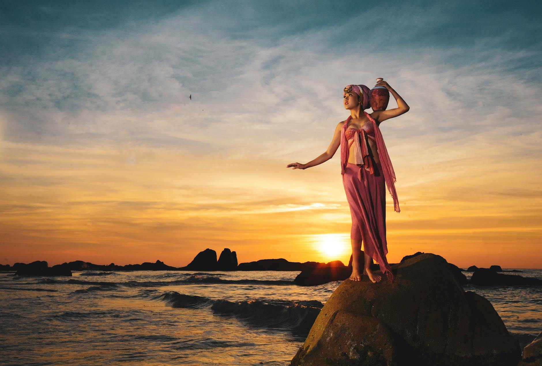 https://www.pexels.com/photo/sunrise-model-posing-on-rock-in-phan-thiet-beach-29148646/