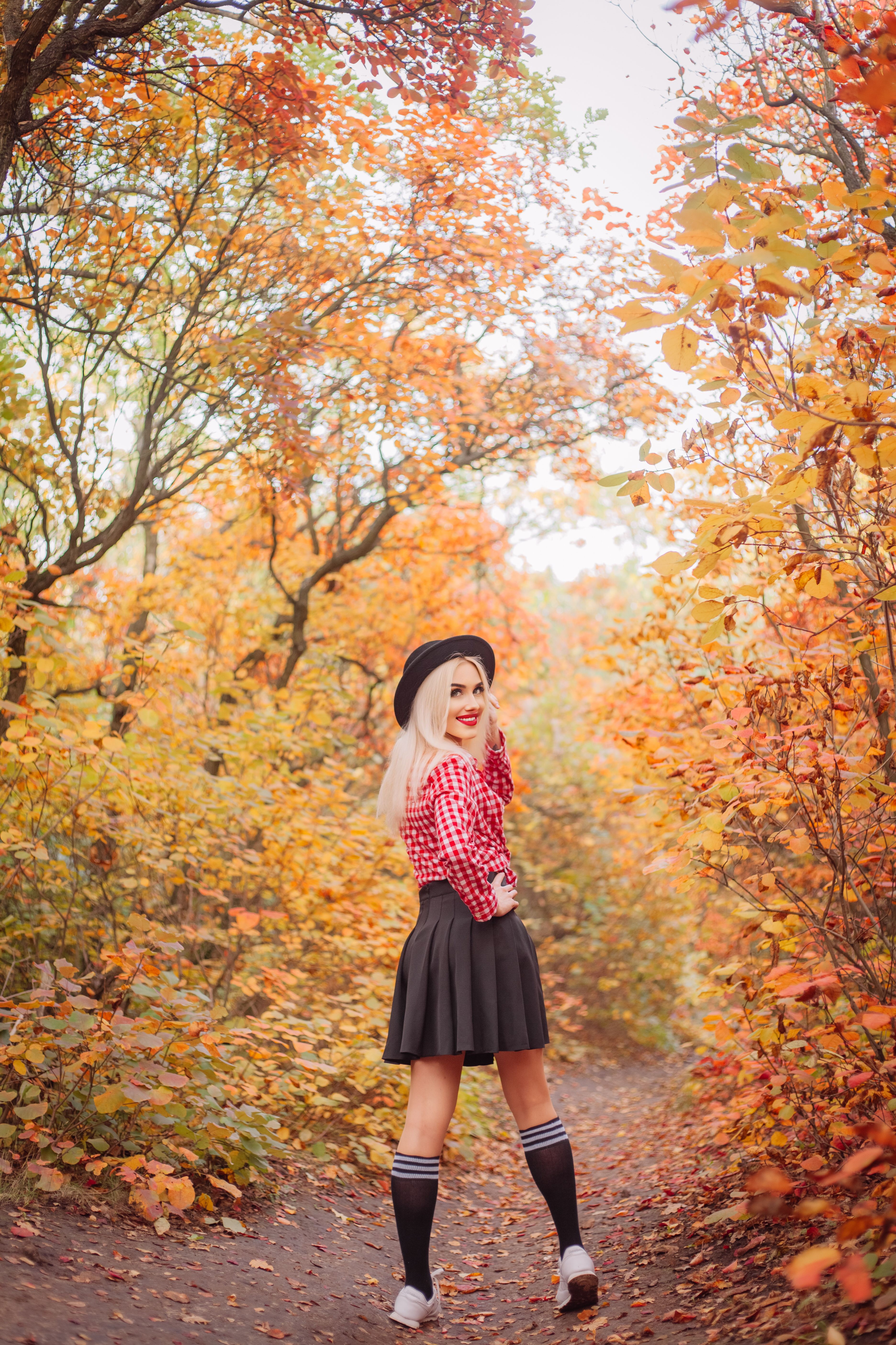 Young Woman Enjoying a Vibrant Autumn Forest · Free Stock Photo