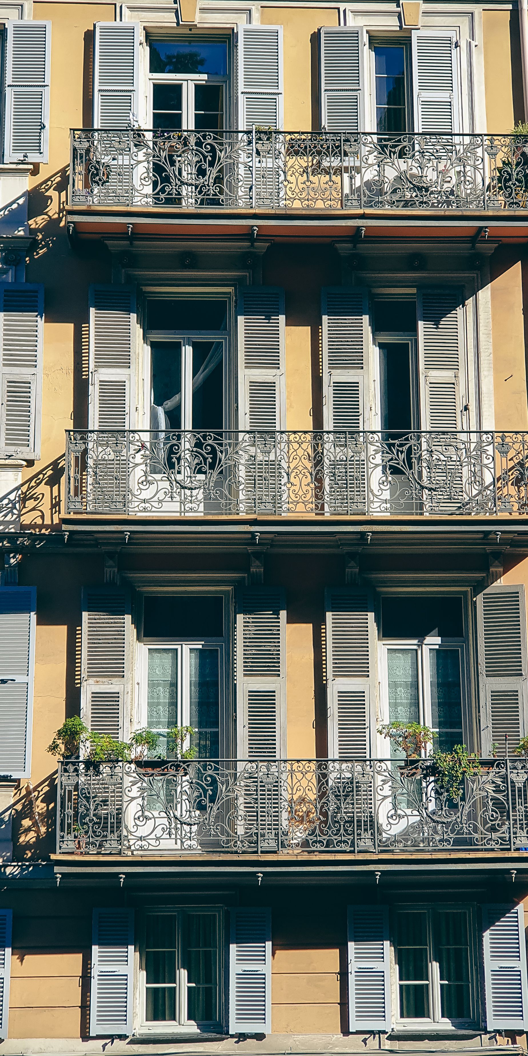 Elegant French Facade with Iron Balconies · Free Stock Photo