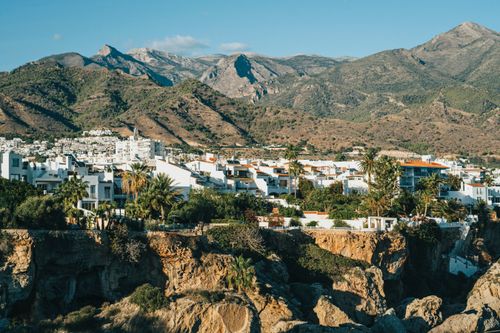 Free Scenic view of Nerja, Andalusia with white buildings and mountains. Perfect for travel and architecture themes. Stock Photo