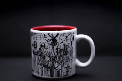  Close-up Photography of White and Black Ceramic Mug 