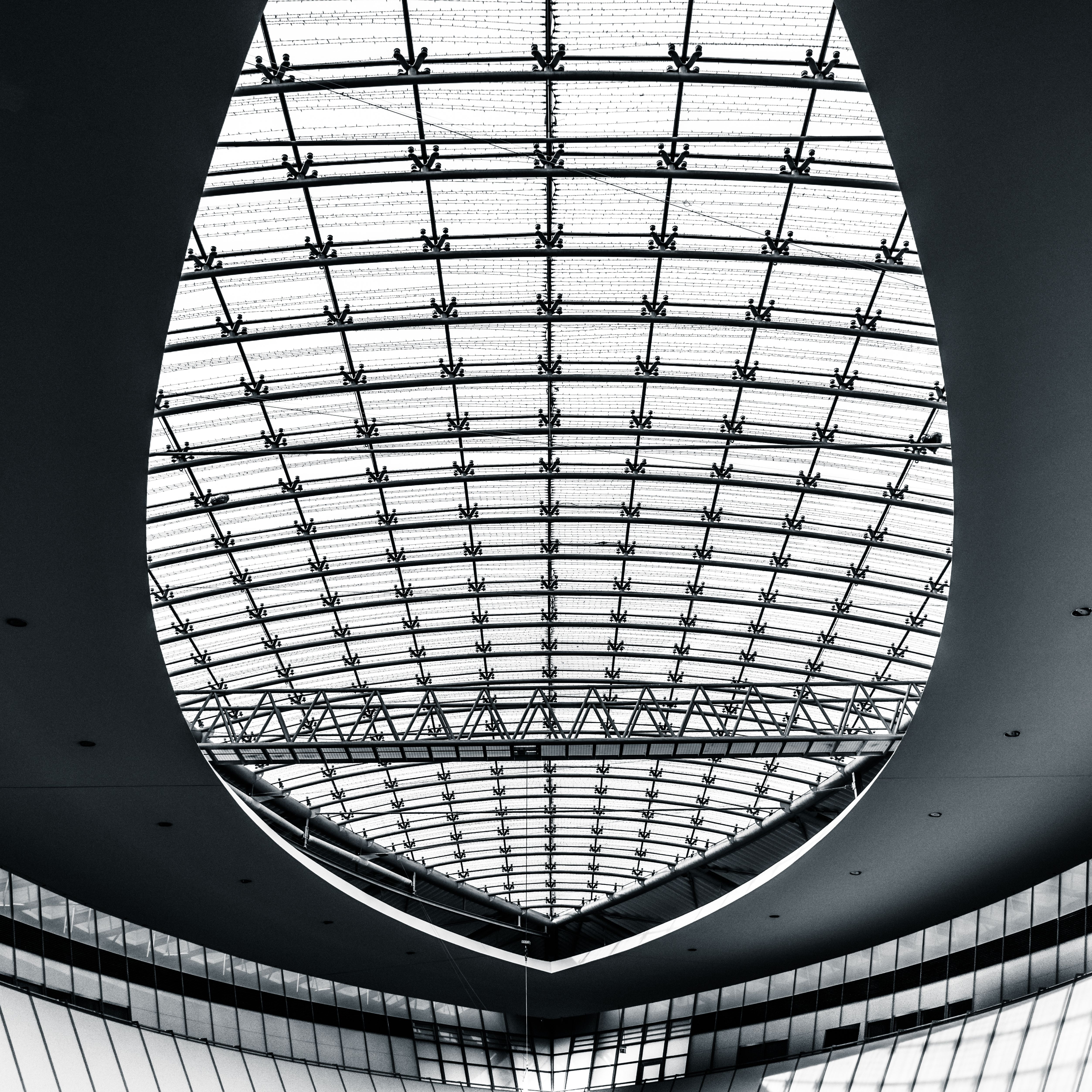 Black and white photograph of a modern dome in Kassel mall showcasing architectural symmetry and design.
