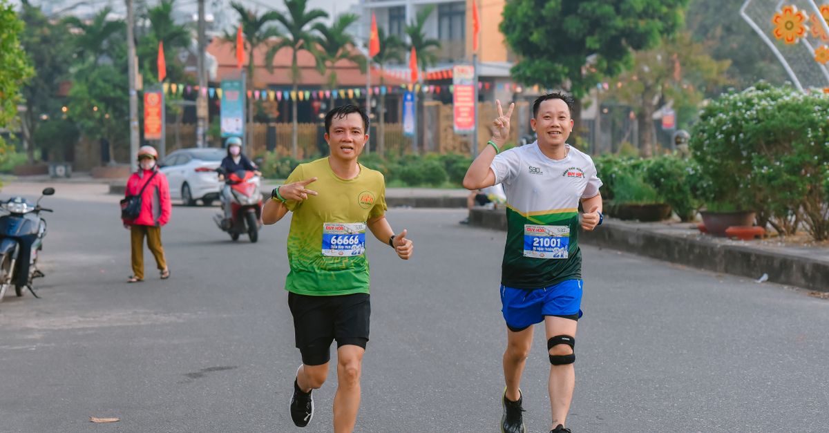 Two Runners Participating in a Outdoor Marathon Event · Free Stock Photo