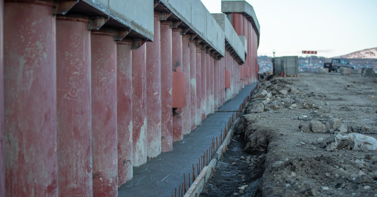 Architect reviewing blueprints on a construction site.