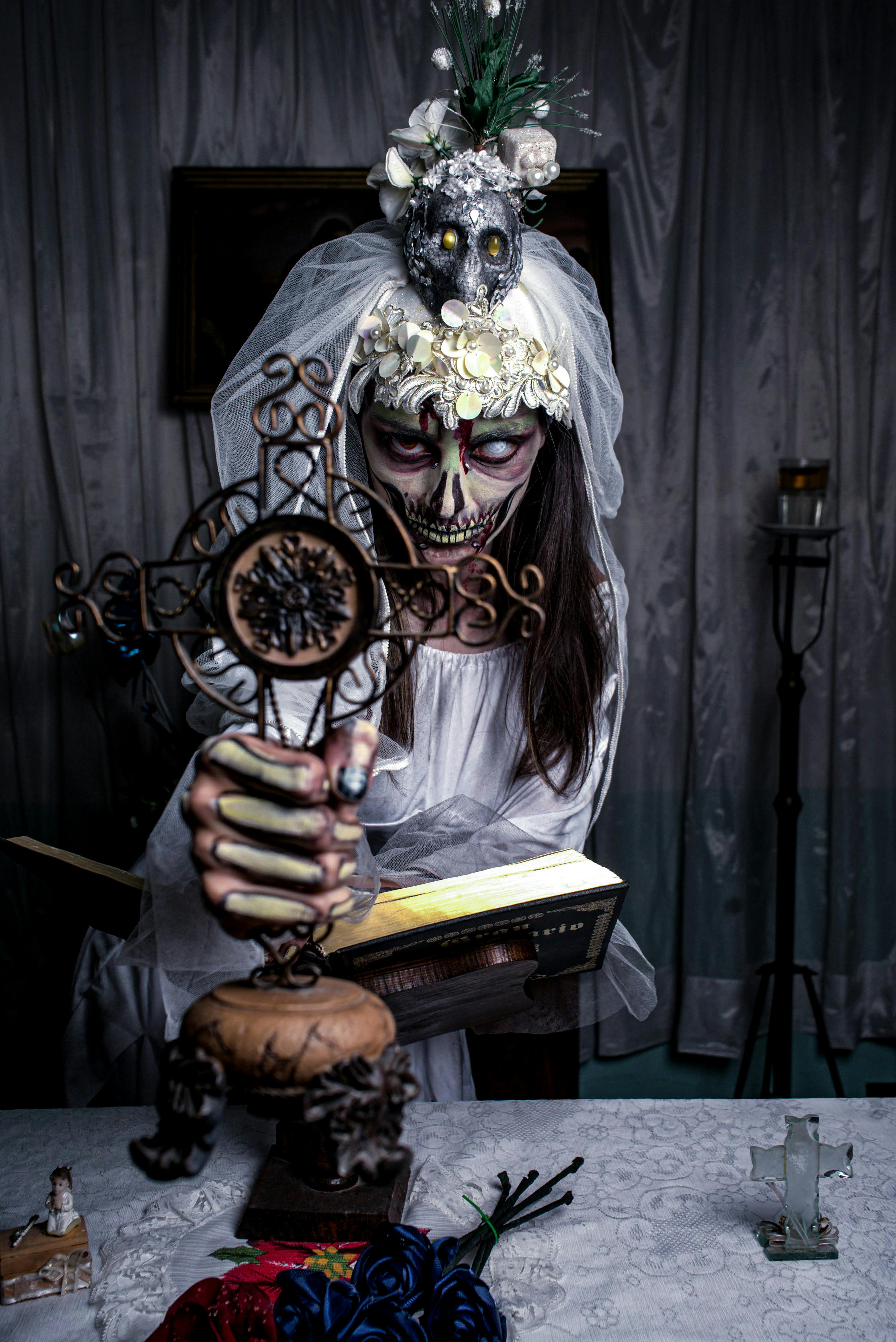 spooky gothic portrait with cross and book