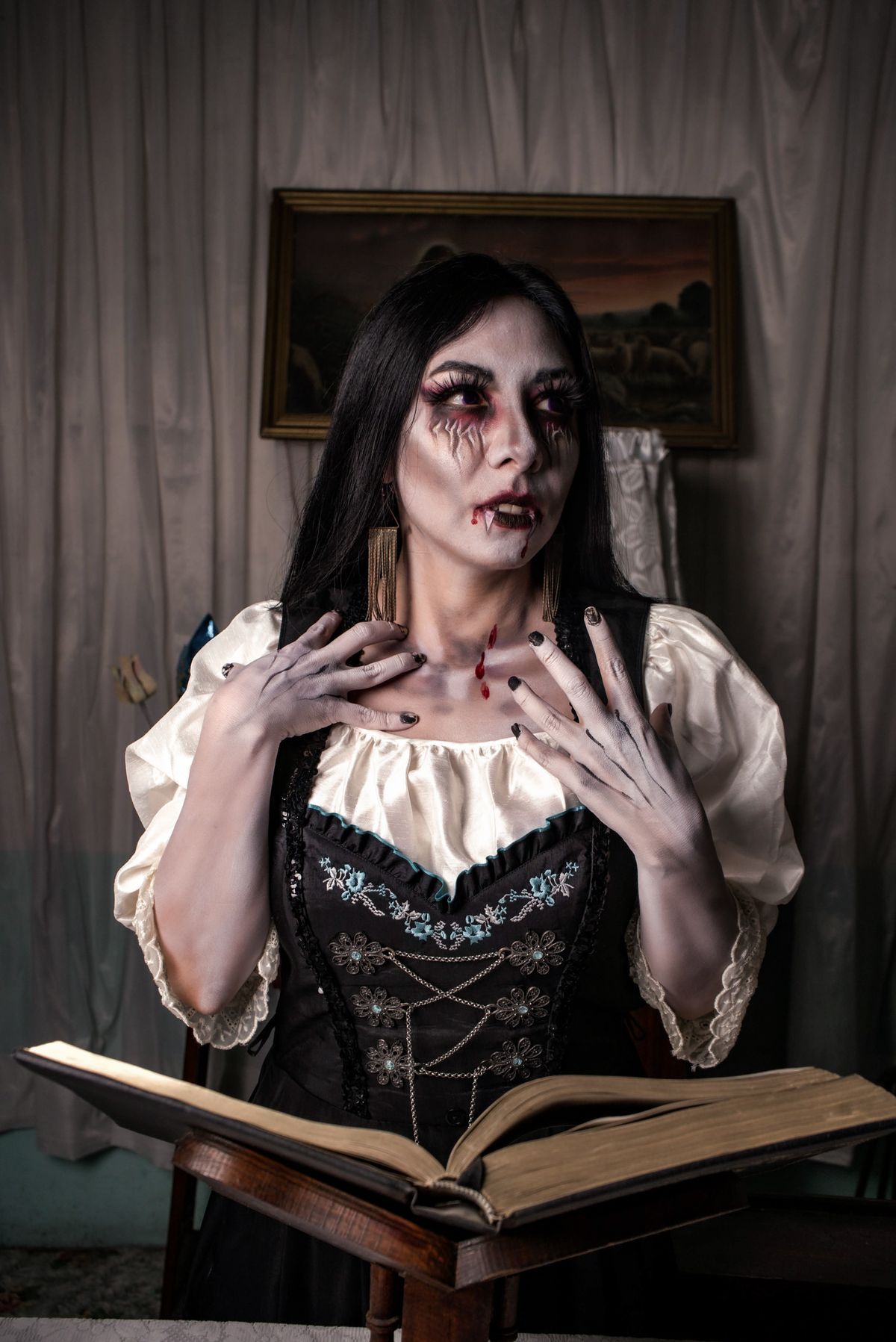 Gothic vampire costume portrait in moody light