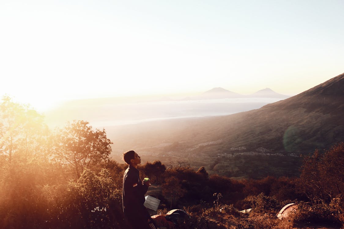 Free Man Standing on Hill Stock Photo