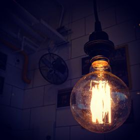Warm filament bulb glowing indoors — photo by Abhinav Goswami on Pexels