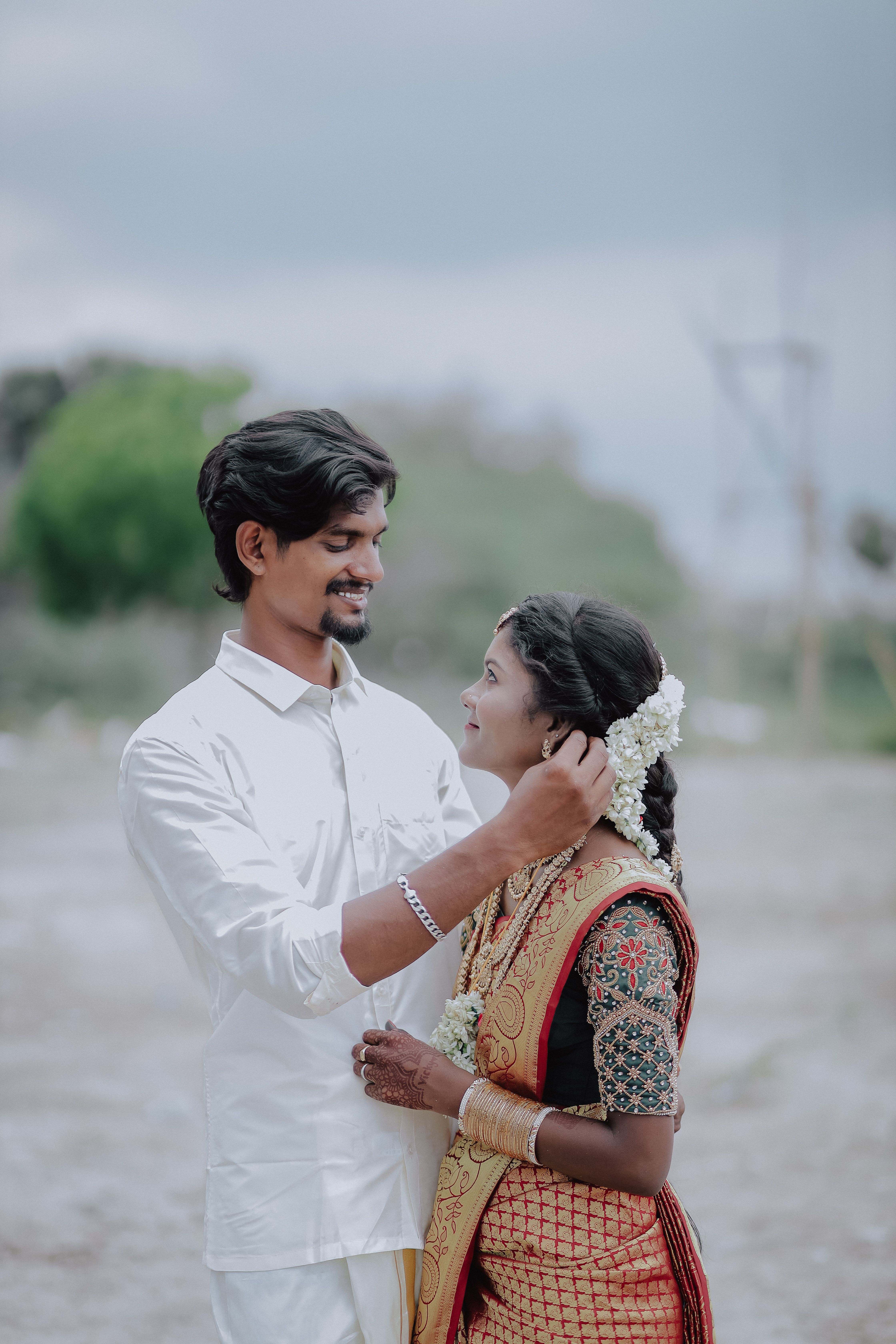 Indian Couple in Traditional Wedding Attire Outdoors · Free Stock Photo