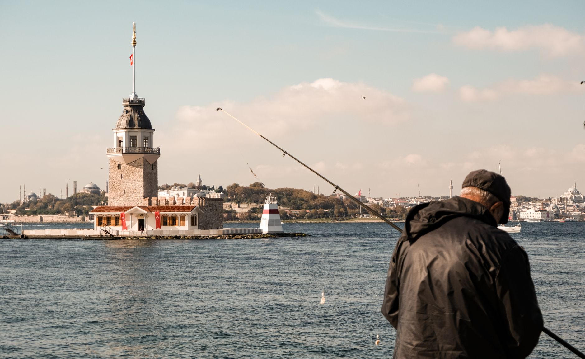 Fisherman with poles