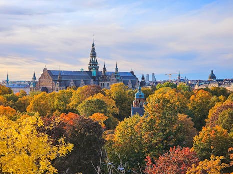 Stunning autumn view of the Nordic Museum in Stockholm, Sweden surrounded by colorful trees.