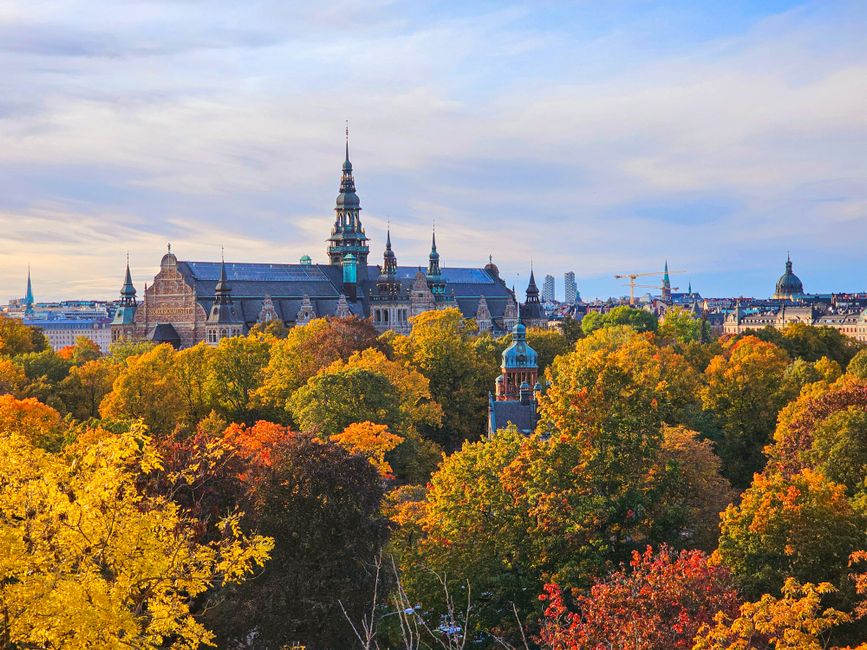 Stunning autumn view of the Nordic Museum in Stockholm, Sweden surrounded by colorful trees.
