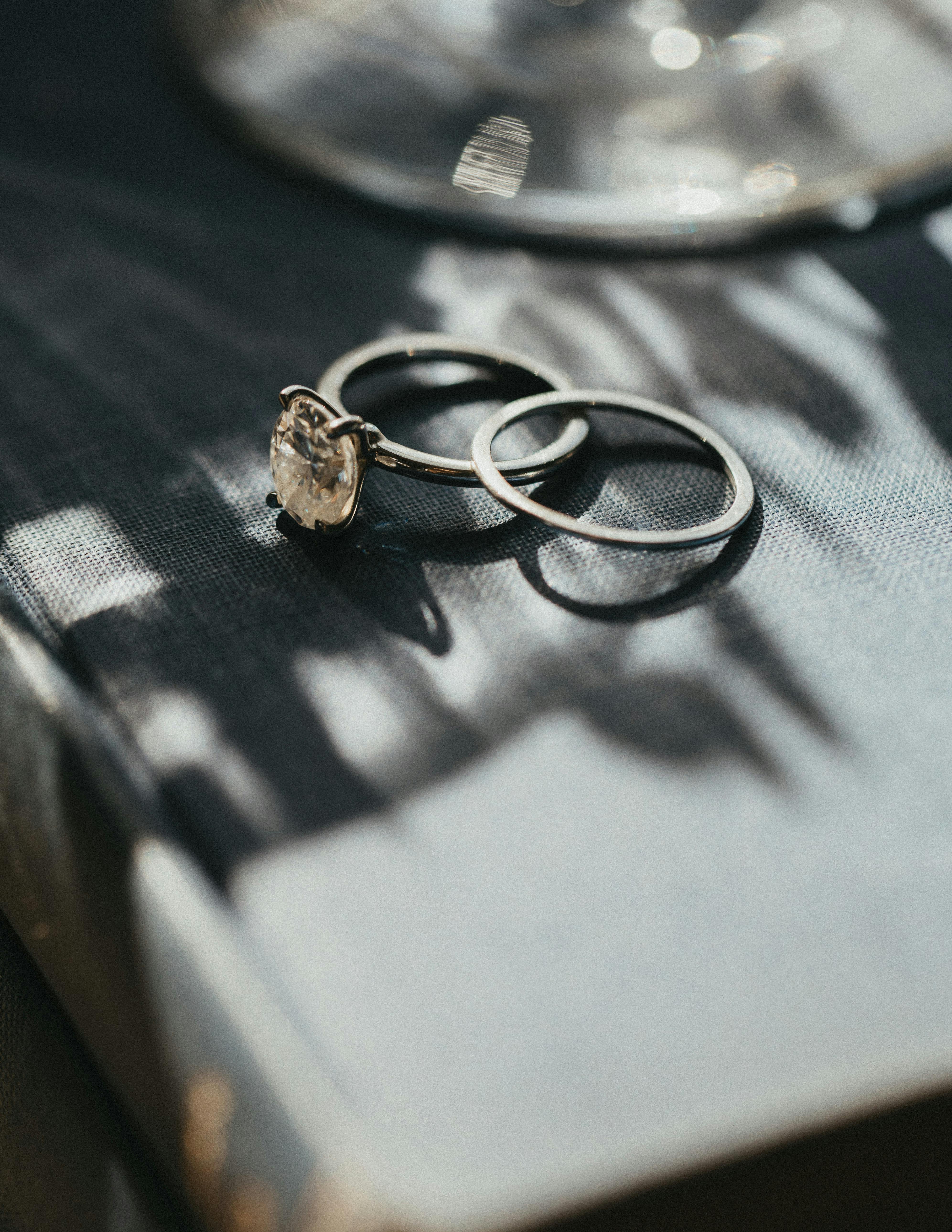 elegant engagement rings on vintage book