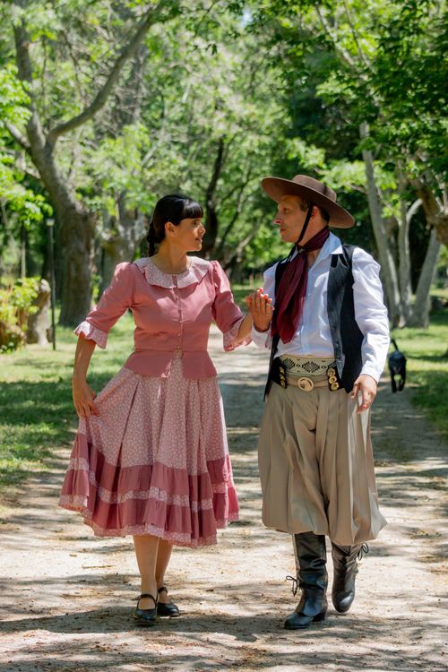 Free Couple in traditional Argentine attire dancing in Chascomús park, Buenos Aires Province. Stock Photo