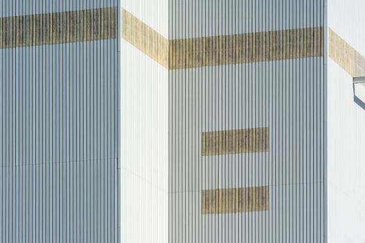 Close-up of a building facade showcasing geometric patterns and vertical lines.