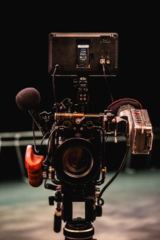Detailed film camera setup on tripod in Toronto studio setting.