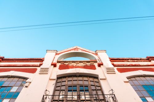 Free Architectural detail of a historic building's facade against clear blue skies in Guanajuato, Mexico. Stock Photo