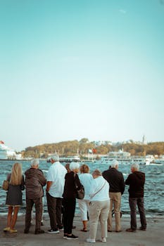 A group of senior adults enjoying the view at Istanbul's waterfront in autumn.