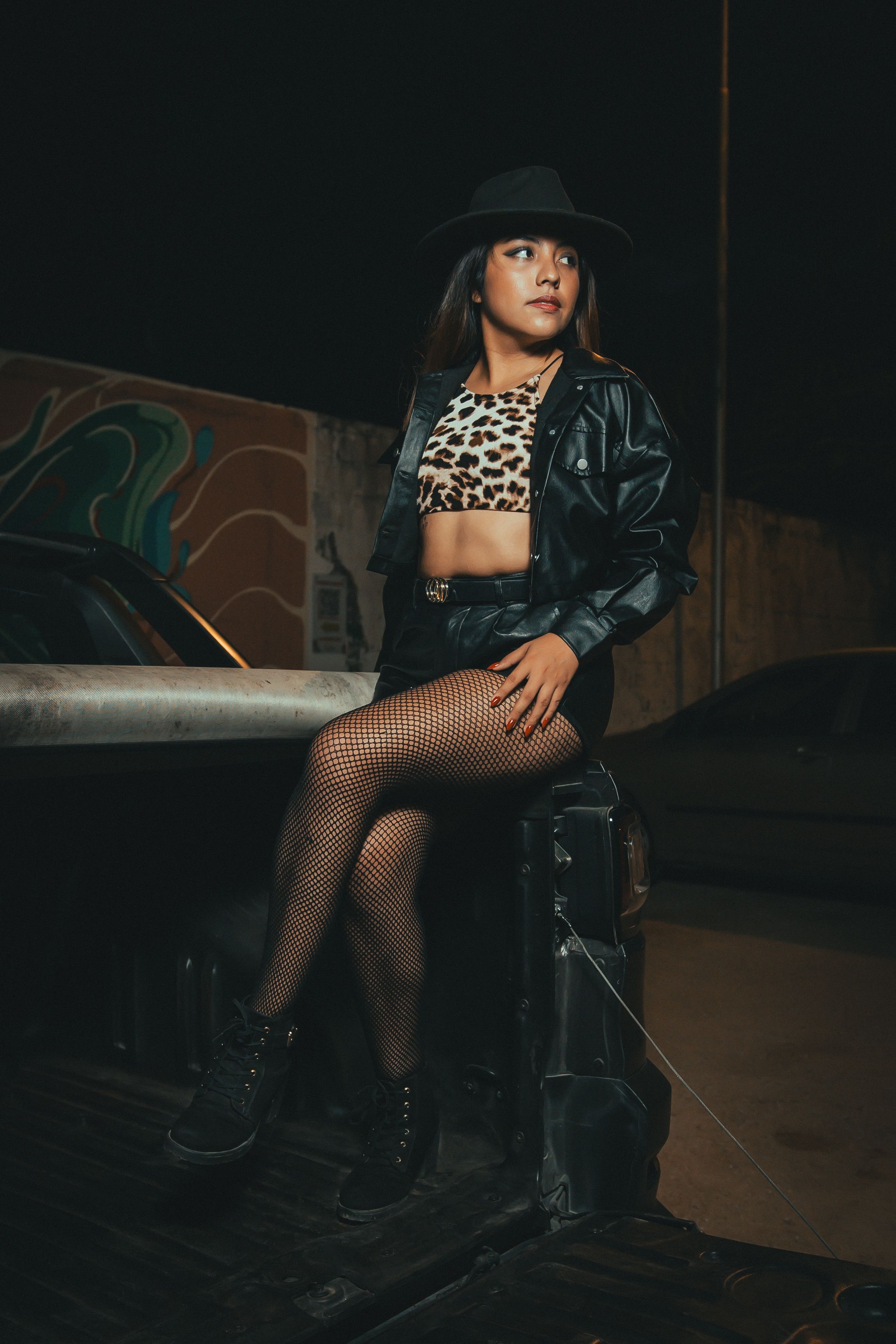 Stylish Woman Posing at Night in Urban Scene · Free Stock Photo