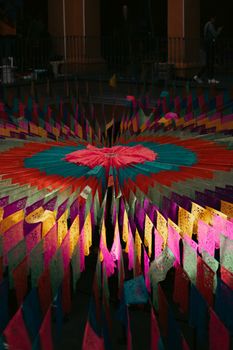 Colorful Día de Muertos decorations at night in Puebla, Mexico, showcasing traditional Mexican culture.