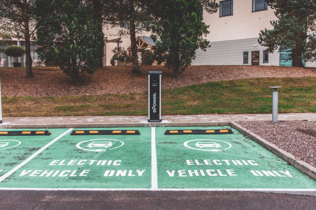 Electric vehicle charging station in urban setting