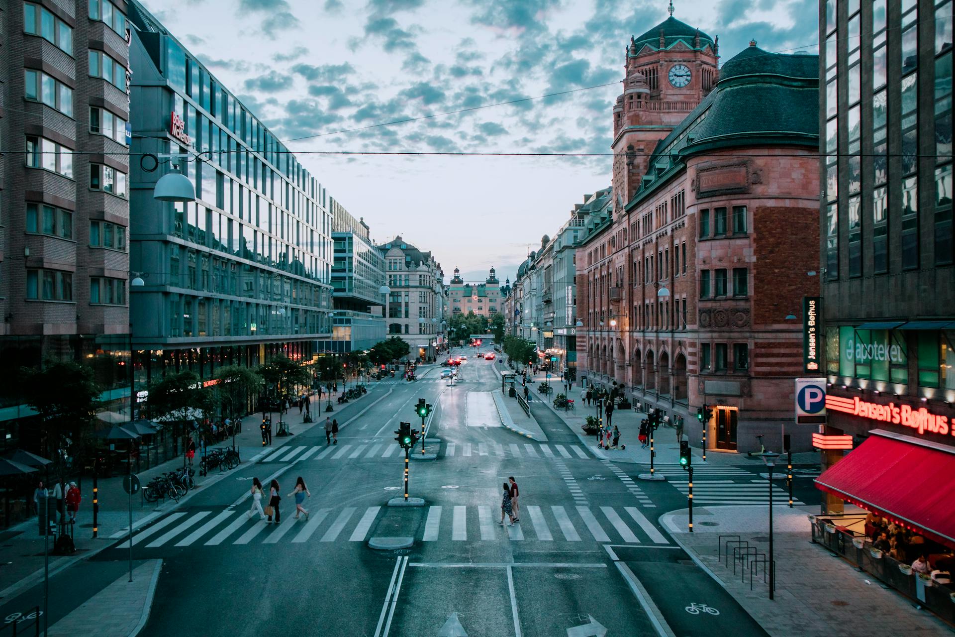 A vibrant evening cityscape of Stockholm with historic architecture and bustling streets.