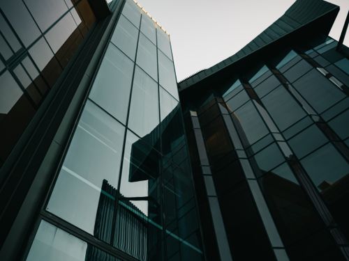 Free A striking view of modern glass building facades in an urban environment, showcasing contemporary architecture. Stock Photo