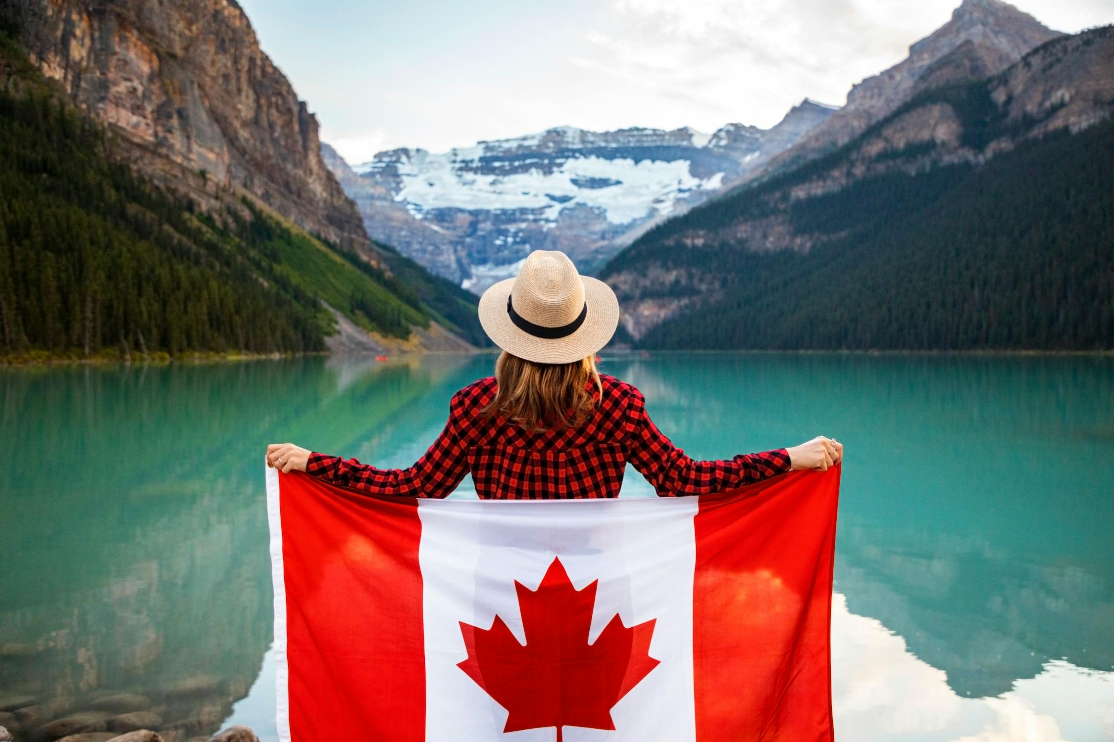 Holding Flag, Contemplating Canadian Wilderness.