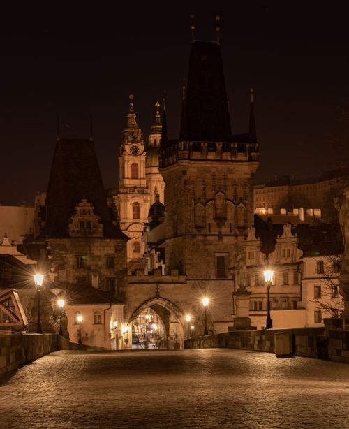 Free A serene night view of Charles Bridge and Old Town Prague, brilliantly illuminated. Stock Photo