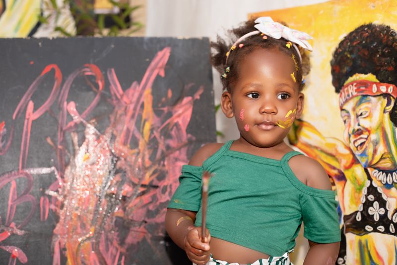 A little girl with paint on her face