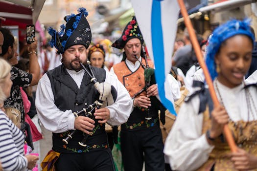 Colorful street musicians playing bagpipes during a festival in Guérande, France.