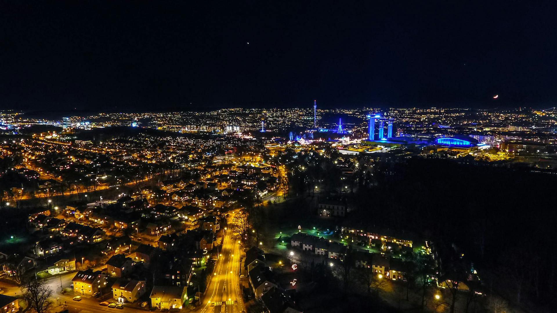 Aerial view of the illuminated Gullbergsvass cityscape at night in Sweden.