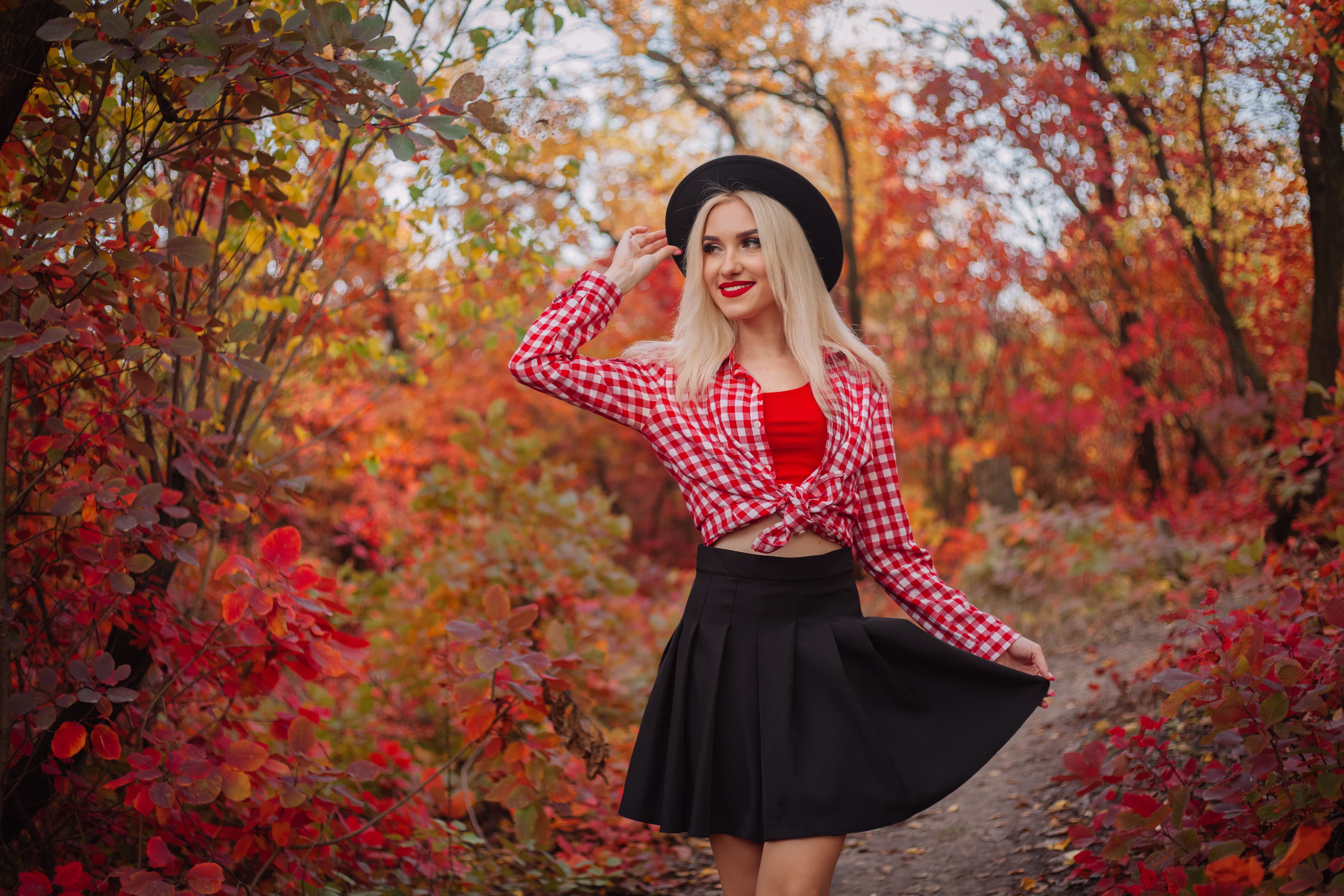 Stylish Woman in Autumn Forest Wearing Plaid Shirt · Free Stock Photo