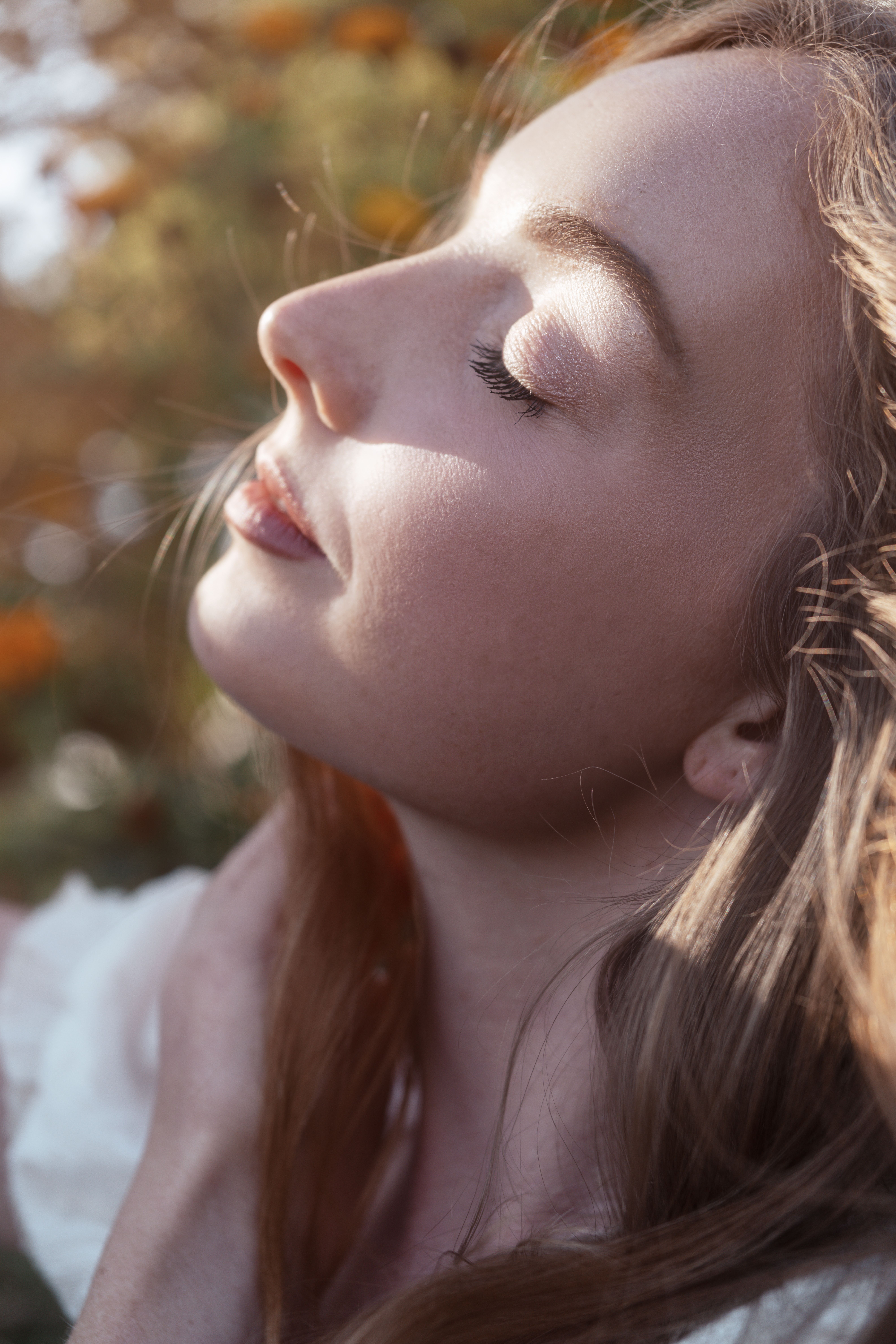 Elena Markova, breathwork and somatics facilitator at Suvarna Wellness, eyes closed in morning light