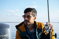 Photo Of Man Holding Fishing Rod