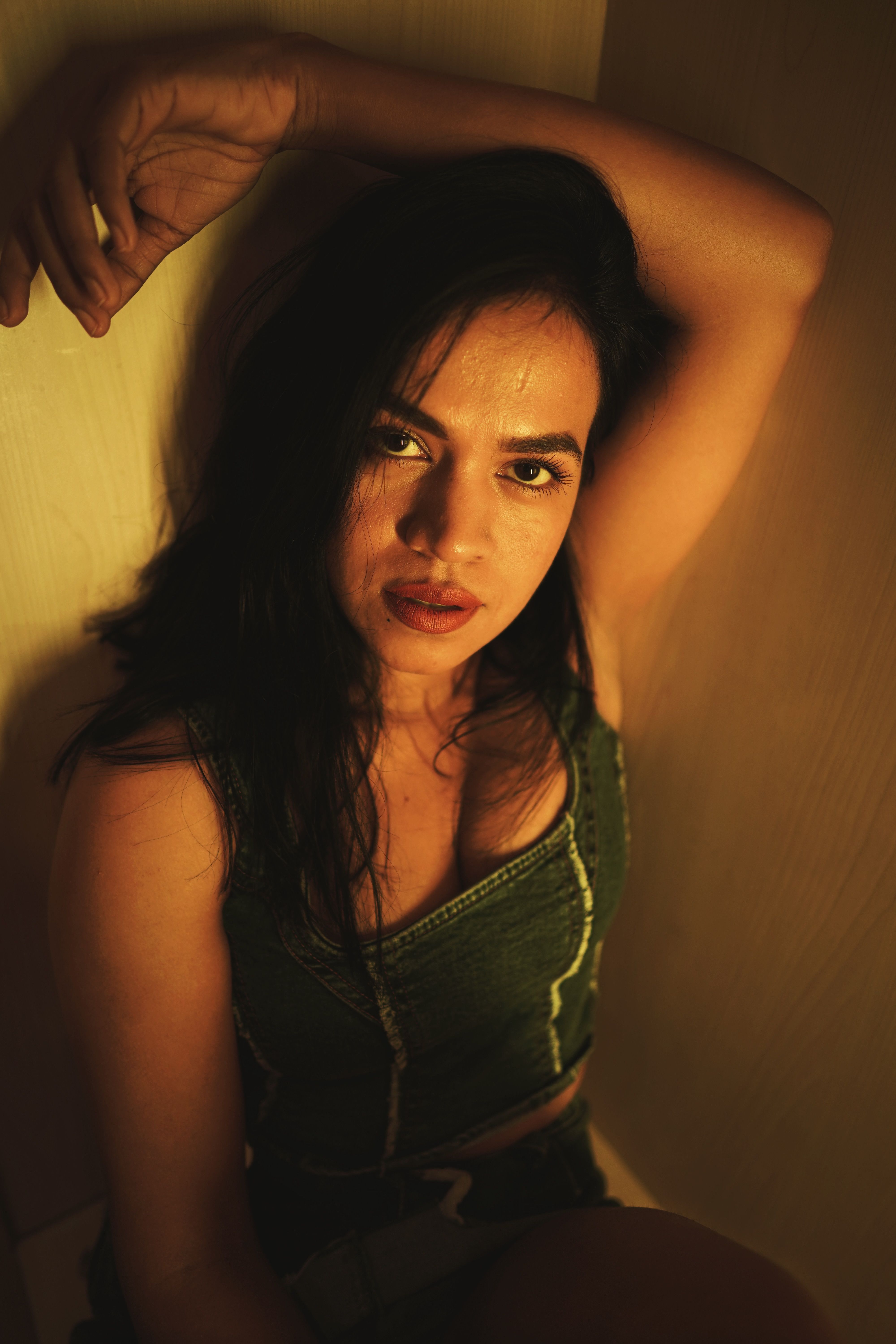 Moody Portrait of a Woman in Dim Lighting · Free Stock Photo