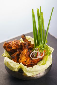 Savor the taste of grilled chicken with fresh vegetables and herbs.